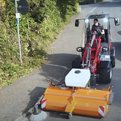Hoftrac 1390 with sweeper